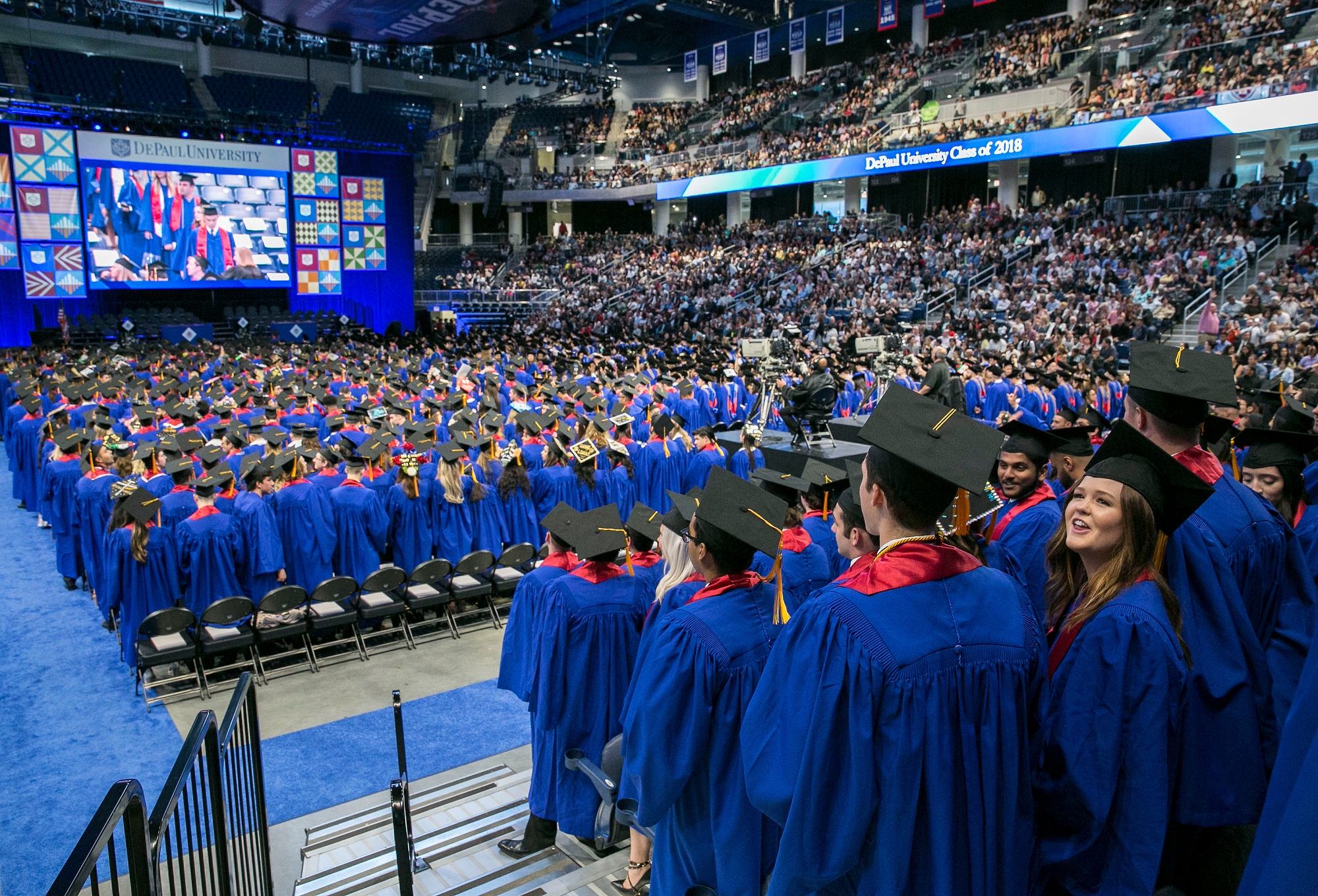 Driehaus College of Business graduates fill the final seats inside Wintrust Arena during their commencement ceremony. (DePaul University/Jamie Moncrief)